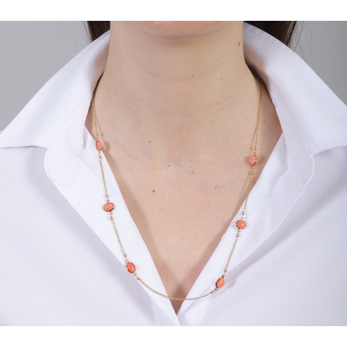 180 - A CORAL NECKLACE  The fine curb-link chain necklace collet-set with oval-shaped coral cabochons, mou... 