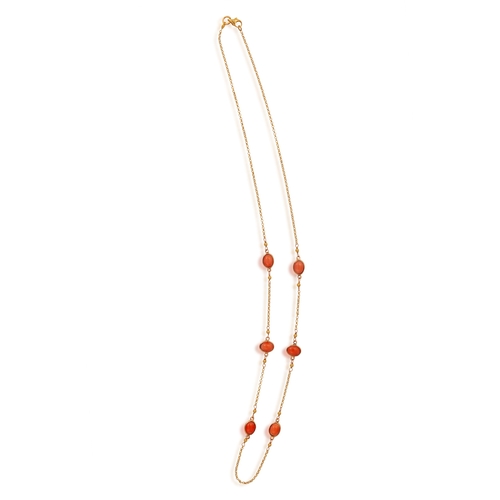 180 - A CORAL NECKLACE  The fine curb-link chain necklace collet-set with oval-shaped coral cabochons, mou... 