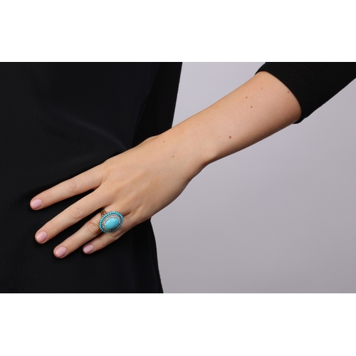 231 - A TURQUOISE AND DIAMOND COCKTAIL RING  Of oval-shaped design, centring an oval-shaped cabochon proba... 