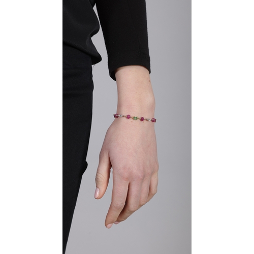 261 - A GEM-SET AND DIAMOND BRACELET  Composed of seven ruby beads framed, highlighted with two marquise-s... 