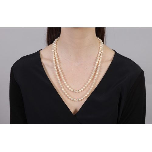 273 - A CULTURED PEARL NECKLACE  The single strand set with round-shaped cultured pearls of white tint, me... 