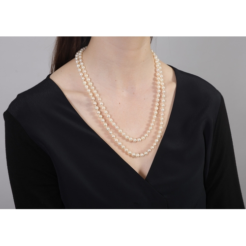 273 - A CULTURED PEARL NECKLACE  The single strand set with round-shaped cultured pearls of white tint, me... 