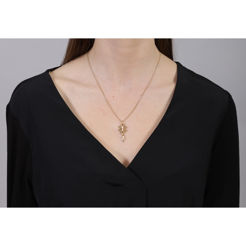 30 - AN 18K GOLD PENDANT NECKLACE  The Saint Esprit pendant suspended from a fine curb-link chain necklac... 