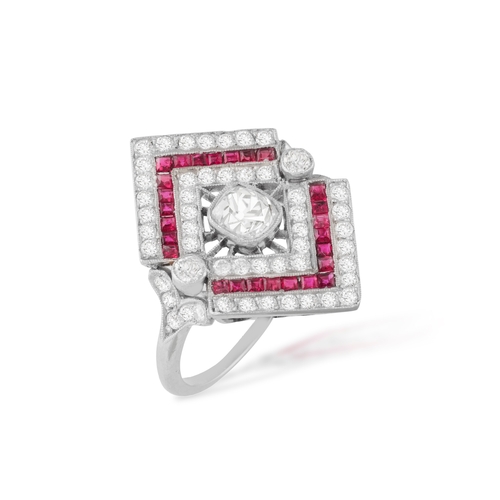 48 - A RUBY AND DIAMOND DRESS RING, FRENCH, CIRCA 1930  The lozenge-shaped mount, millegrain-set to the c... 