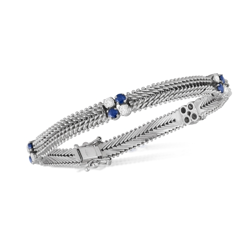 70 - AN 18K WHITE GOLD, SAPPHIRE AND DIAMOND BRACELET   Of fancy-link design, enhanced by clusters of cir... 