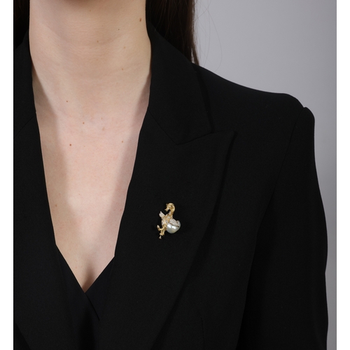 71 - FÜRST: A DIAMOND, CULTURED PEARL AND RUBY NOVELTY BROOCH  Modelled as a duck, its tail set with a ba... 