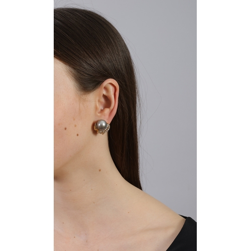 80 - A PAIR OF CULTURED PEARL AND DIAMOND EARCLIPS  Each set with a cultured pearl of grey tint, measurin... 