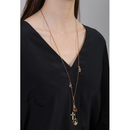 85 - A GOLD CHARM NECKLACE  Composed of a cable-link chain with swivel clasp, suspending various charms s... 