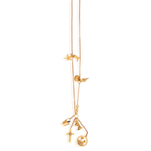 85 - A GOLD CHARM NECKLACE  Composed of a cable-link chain with swivel clasp, suspending various charms s... 