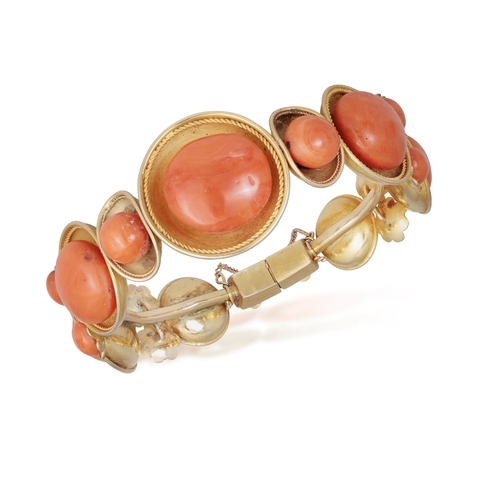 92 - A CORAL DEMI PARURE AND A NECKLACE  Comprising: a hinged bangle, a brooch, a pair of ear clips and a... 