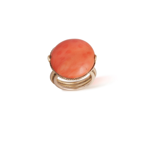 92 - A CORAL DEMI PARURE AND A NECKLACE  Comprising: a hinged bangle, a brooch, a pair of ear clips and a... 