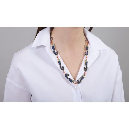 94 - A LAPIS LAZULI, TURQUOISE AND CORAL NECKLACE  Designed as a continuous row of fancy-shaped motifs, i... 