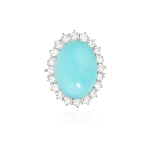 100 - A TURQUOISE AND DIAMOND CLUSTER RING  The oval-shaped turquoise cabochon weighing approximately 40.0... 