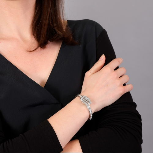 101 - A LADY'S DIAMOND COCKTAIL SECRET WATCH, CIRCA 1955  The 10-jewel manual wind movement, with central ... 