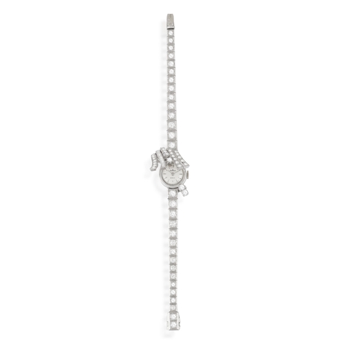 101 - A LADY'S DIAMOND COCKTAIL SECRET WATCH, CIRCA 1955  The 10-jewel manual wind movement, with central ... 