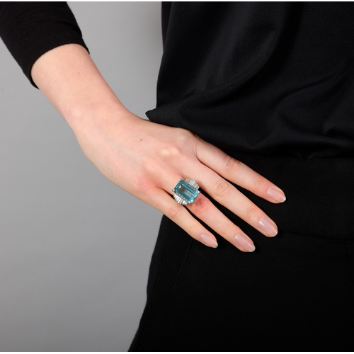 104 - A FINE AQUAMARINE AND DIAMOND RING, FRENCH, CIRCA 1960  The raised and elongated rectangular-cut aqu... 