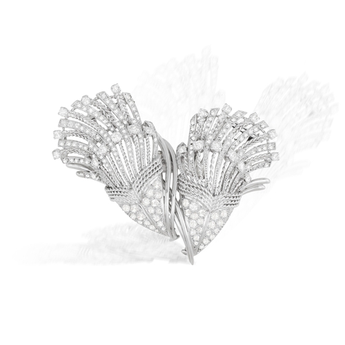 107 - A MID-20TH CENTURY DIAMOND DOUBLE CLIP BROOCH, FRENCH, CIRCA 1955  Of cornucopia design, the two mot... 