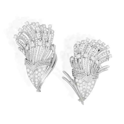 107 - A MID-20TH CENTURY DIAMOND DOUBLE CLIP BROOCH, FRENCH, CIRCA 1955  Of cornucopia design, the two mot... 