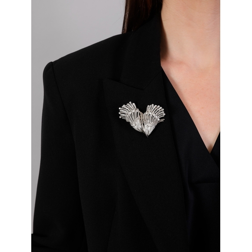107 - A MID-20TH CENTURY DIAMOND DOUBLE CLIP BROOCH, FRENCH, CIRCA 1955  Of cornucopia design, the two mot... 