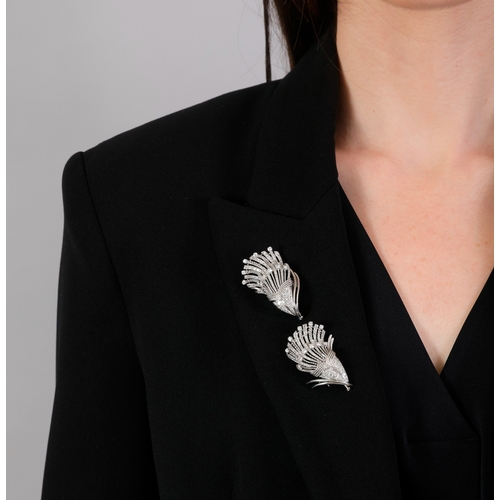107 - A MID-20TH CENTURY DIAMOND DOUBLE CLIP BROOCH, FRENCH, CIRCA 1955  Of cornucopia design, the two mot... 