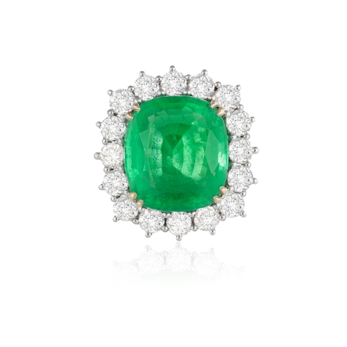 117 - AN EMERALD AND DIAMOND CLUSTER RING  The cushion-shaped emerald, weighing approximately 8.80cts, wit... 