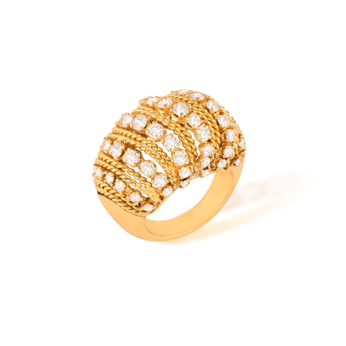 118 - A DIAMOND RING  Of openwork bombé design, set with a series of brilliant-cut diamonds between ropetw... 