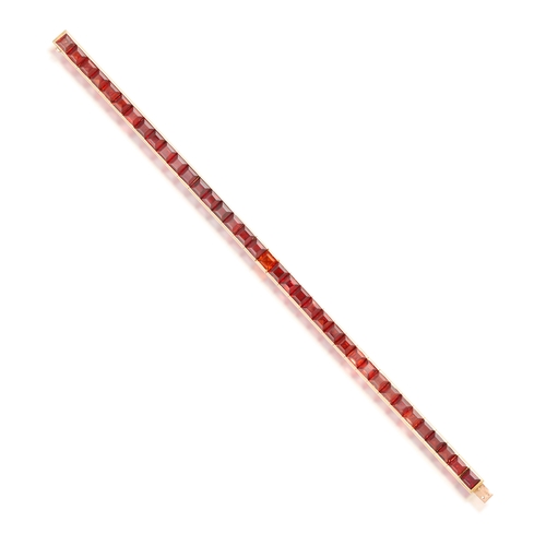 72 - TIFFANY & CO.: A RETRO CITRINE LINE BRACELET, CIRCA 1940  Of articulated design, the continuous row ... 