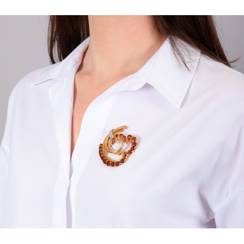75 - BOUCHERON: A RETRO CITRINE AND DIAMOND BROOCH, CIRCA 1940  Of foliate design, the triple gold and ci... 