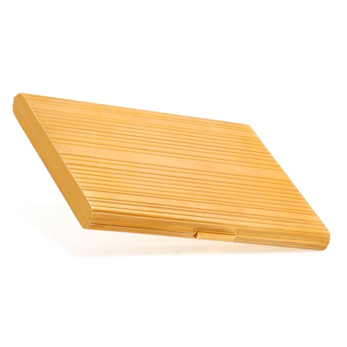 82 - HAST: A MID-20TH CENTURY GOLD CIGARETTE CASE  Of large rectangular form, all-over reeded decoration ... 