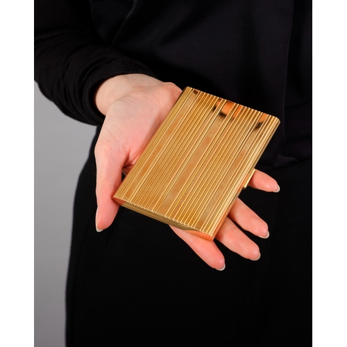 82 - HAST: A MID-20TH CENTURY GOLD CIGARETTE CASE  Of large rectangular form, all-over reeded decoration ... 
