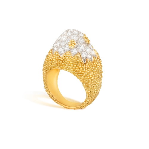 84 - A DIAMOND COCKTAIL RING   The bi-coloured mount of arched domed design, pavé-set with brilliant-cut ... 