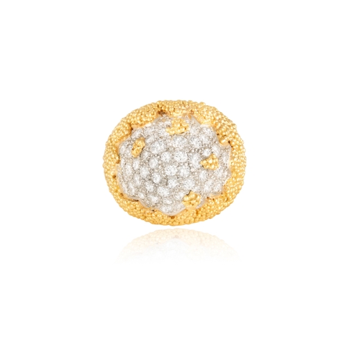 84 - A DIAMOND COCKTAIL RING   The bi-coloured mount of arched domed design, pavé-set with brilliant-cut ... 