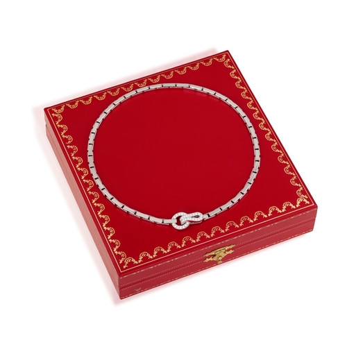 88 - CARTIER: A DIAMOND 'AGRAFE' NECKLACE  Composed of a fancy-link chain, centring a hook-and-loop clasp... 