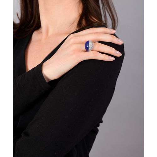 95 - M. GÉRARD: A COLLECTIBLE LAPIS LAZULI AND DIAMOND DRESS RING, CIRCA 1975  Of bombé design, the front... 