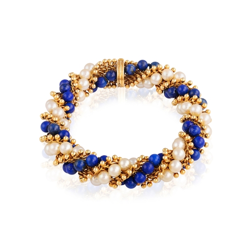 96 - VAN CLEEF & ARPELS: A LAPIS LAZULI, CULTURED PEARL AND GOLD 'TWIST' BRACELET, CIRCA 1965  Of twist r... 