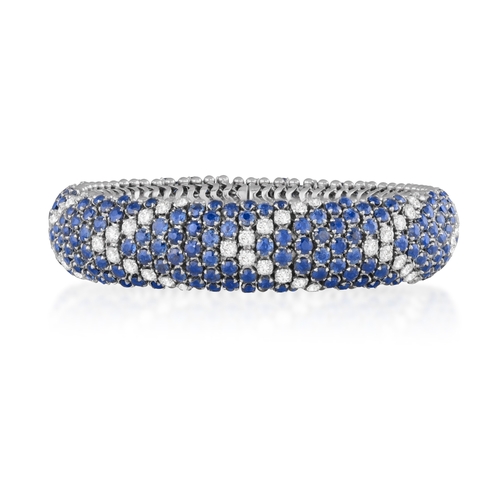 99 - AN ELEGANT SAPPHIRE AND DIAMOND BRACELET, ITALIAN, CIRCA 1960  Of fine articulated bombé design, set... 