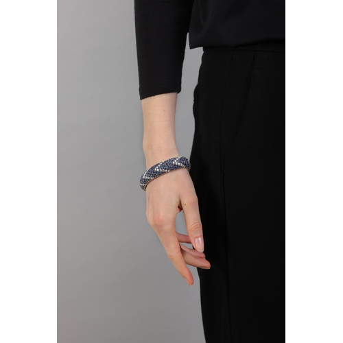 99 - AN ELEGANT SAPPHIRE AND DIAMOND BRACELET, ITALIAN, CIRCA 1960  Of fine articulated bombé design, set... 