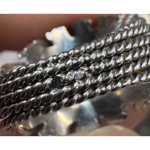 108 - PIERRE STERLÉ: A RARE DIAMOND RING, CIRCA 1960  Of openwork dome design, the brilliant-cut diamond w... 