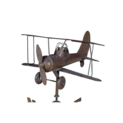 A COPPER AND WROUGHT IRON AIRPLANE WEATHER VANE, the propeller plane ...