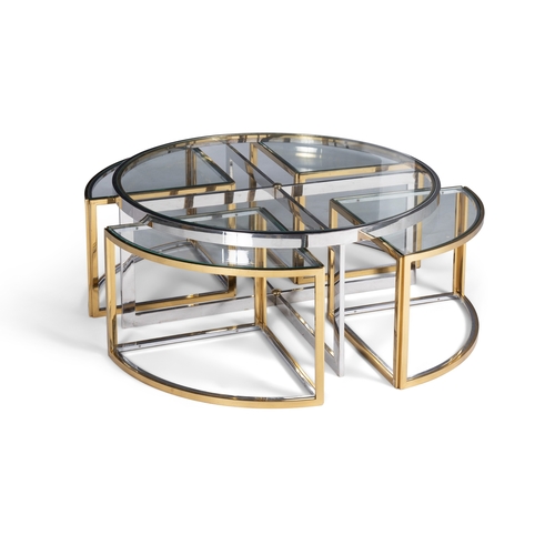 103 - TABLE  A gilt metal and chrome circular glass-topped coffee table with a nest of four tables. Italy,... 