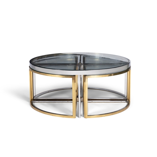 103 - TABLE  A gilt metal and chrome circular glass-topped coffee table with a nest of four tables. Italy,... 