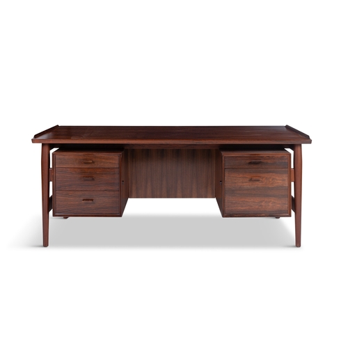 113 - ARNE VODDER (1926-2009)  A rosewood desk by Arne Vodder by Sibast, with maker’s label. Denmark... 