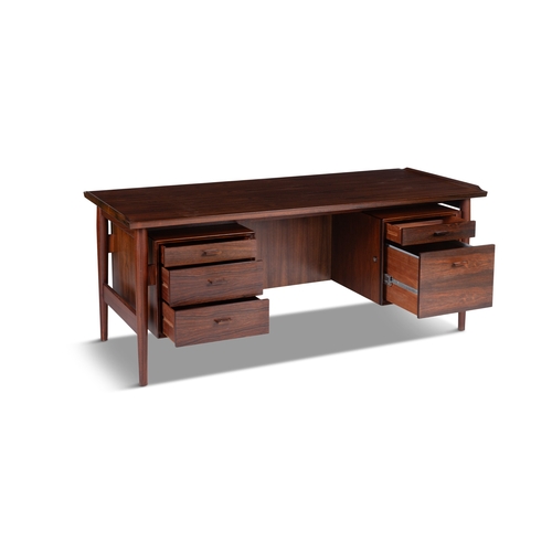 113 - ARNE VODDER (1926-2009)  A rosewood desk by Arne Vodder by Sibast, with maker’s label. Denmark... 