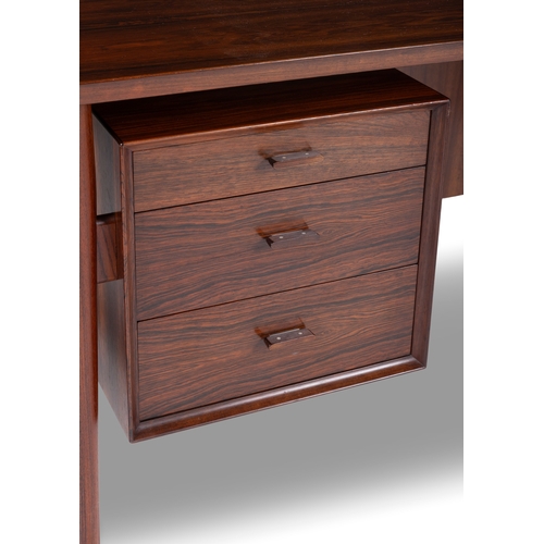 113 - ARNE VODDER (1926-2009)  A rosewood desk by Arne Vodder by Sibast, with maker’s label. Denmark... 