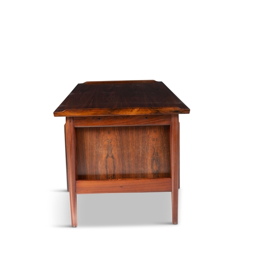 113 - ARNE VODDER (1926-2009)  A rosewood desk by Arne Vodder by Sibast, with maker’s label. Denmark... 