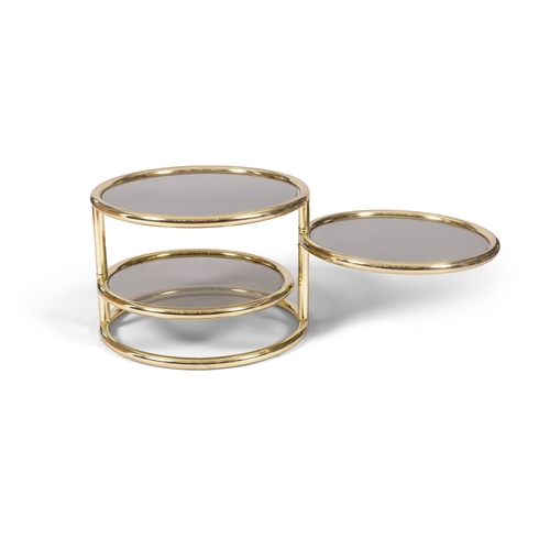 201 - COFFEE TABLE  A gilt metal and smoked glass topped three tier coffee table with rotating tops. Italy... 