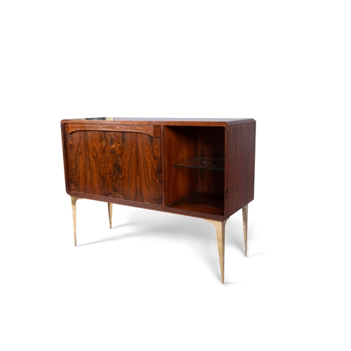 32 - BAR CABINET  A rosewood cabinet on solid brass legs, with a drop down door. Italy, c.1960, 130 x 45 ... 