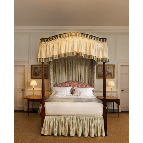 461 - A GEORGE III STYLE MAHOGANY AND POLYCHROME-DECORATED FOUR-POSTER BED,   with fluted front supports, ... 