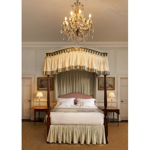 461 - A GEORGE III STYLE MAHOGANY AND POLYCHROME-DECORATED FOUR-POSTER BED,   with fluted front supports, ... 