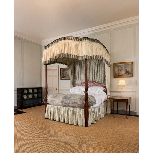 461 - A GEORGE III STYLE MAHOGANY AND POLYCHROME-DECORATED FOUR-POSTER BED,   with fluted front supports, ... 